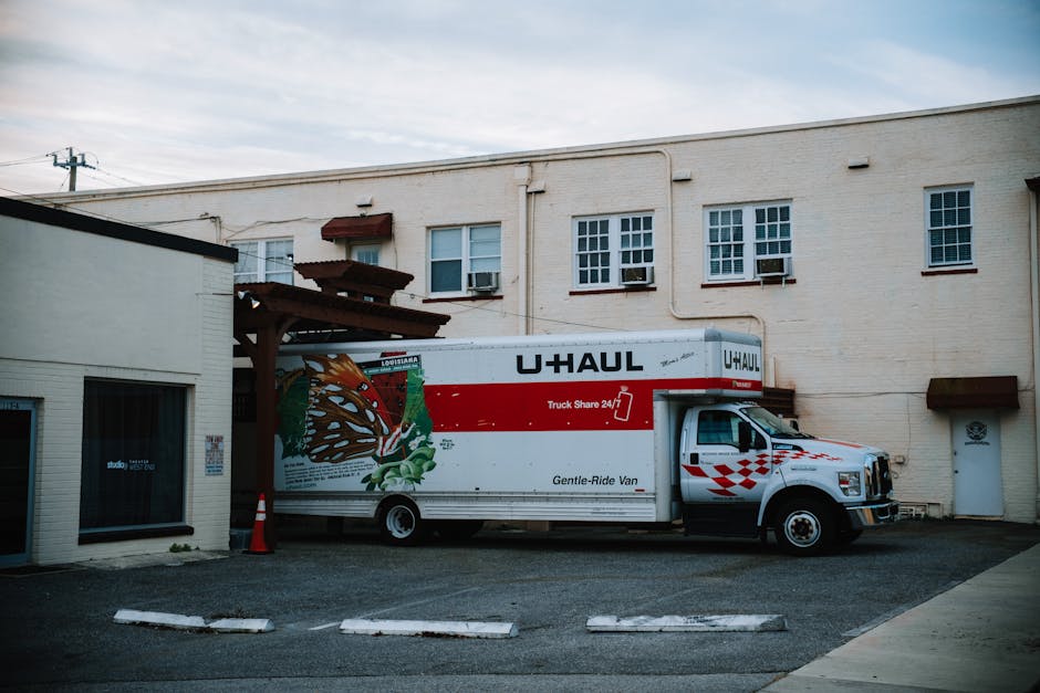 Moving truck parked safely outside a residential home